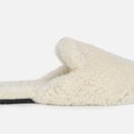 Custom shearling mule slippers with customizable sole thickness and monogramming services.
