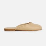 Women’s flat beige leather mules - slip-on backless closed-toe shoes, casual everyday footwear in neutral tone.