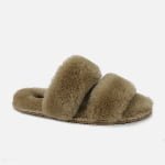 A custom neutral-tone slipper crafted from soft sheepskin, featuring a two-strap design and personalized sizing.