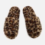 A personalized slide slipper in leopard pattern, crafted from soft faux shearling fur with custom design details.
