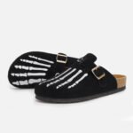 Custom-made black mule clogs: bold skeleton hand embroidery, adjustable gold buckle, designed to your perfect size.