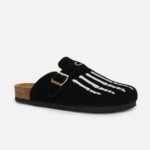Custom black cow suede mules with white skeleton hand embroidery, gold buckle detail, custom-fit for edgy casual style.